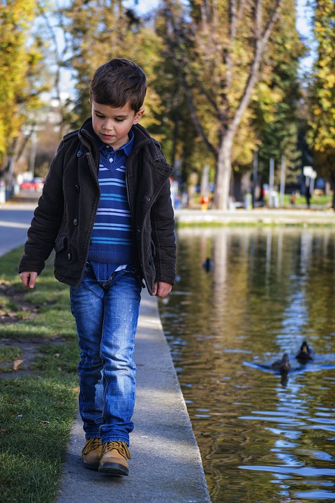 toddler walking in park